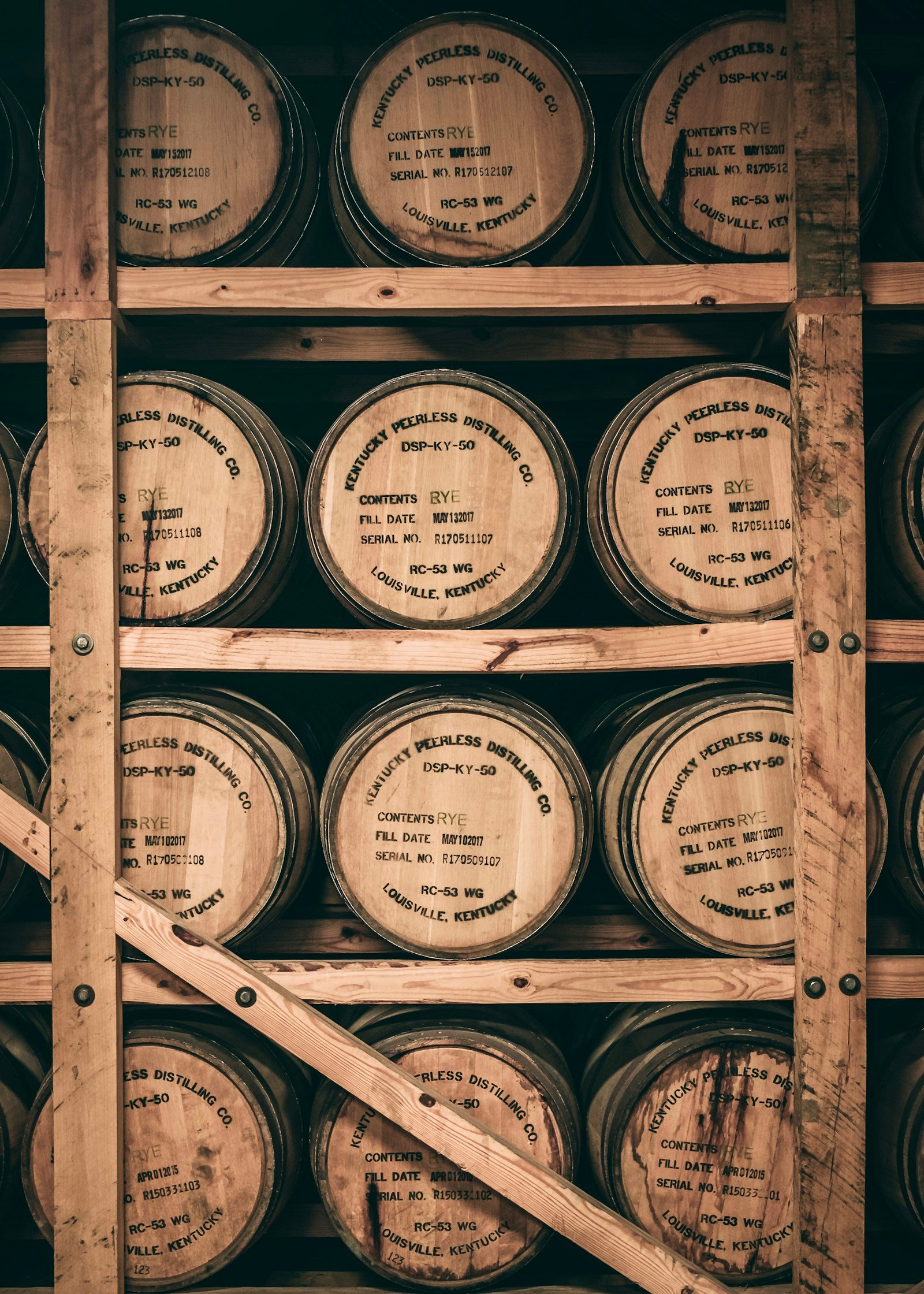 Aging whiskey barrels inside a Kentucky rickhouse